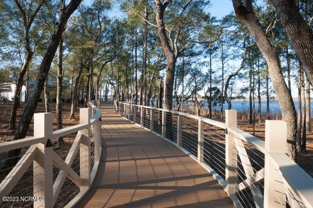 wooden deck featuring a water view