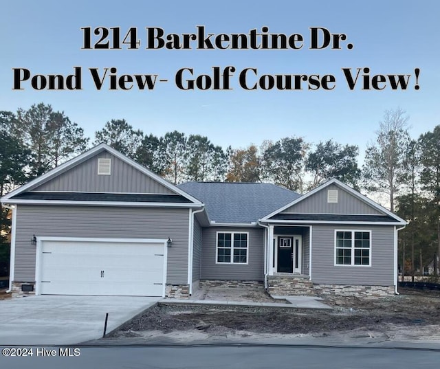 view of front of house featuring concrete driveway, an attached garage, and a shingled roof