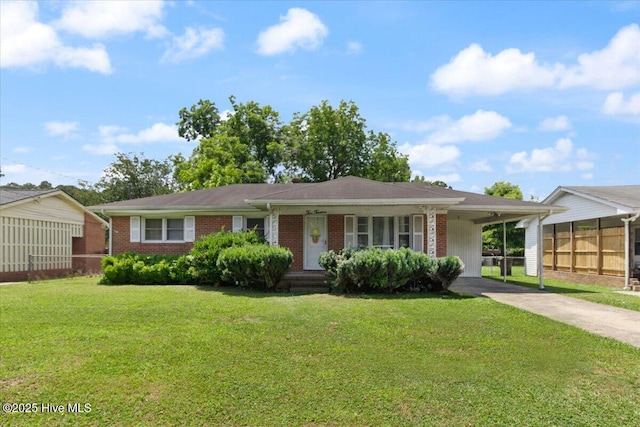 212 Bunche Dr, Goldsboro, NC 27530 - ranch-style home with driveway, brick siding, and a carport