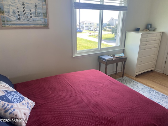 bedroom with hardwood / wood-style floors