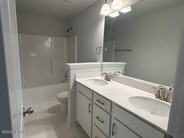 full bathroom with vanity, toilet, and shower / bathtub combination