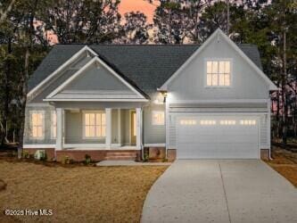 view of front of house featuring a garage and concrete driveway