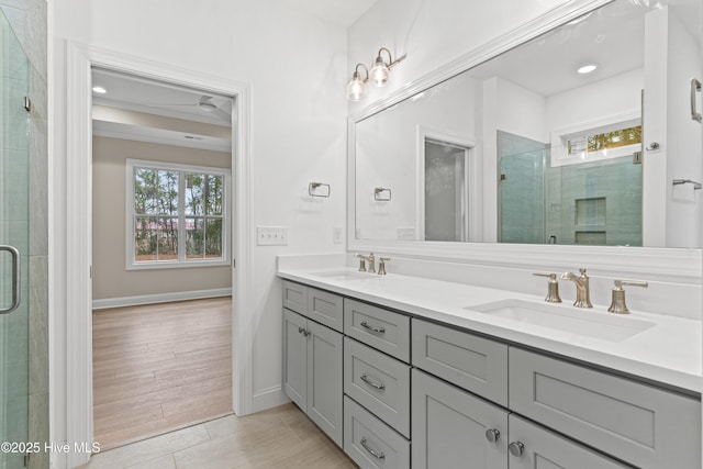 full bath with plenty of natural light, a sink, and a shower stall