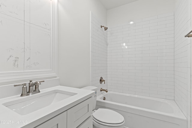 bathroom with toilet, vanity, and bathing tub / shower combination