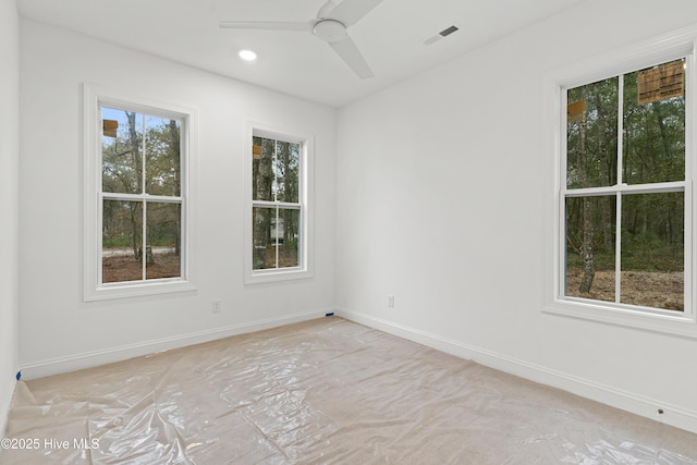 spare room featuring ceiling fan, visible vents, baseboards, and recessed lighting