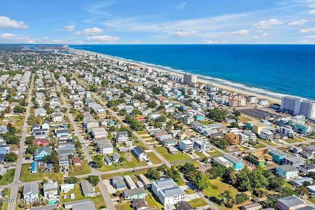 bird's eye view with a water view and a beach view