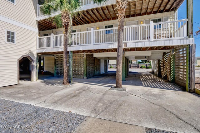 exterior space with a carport and concrete driveway