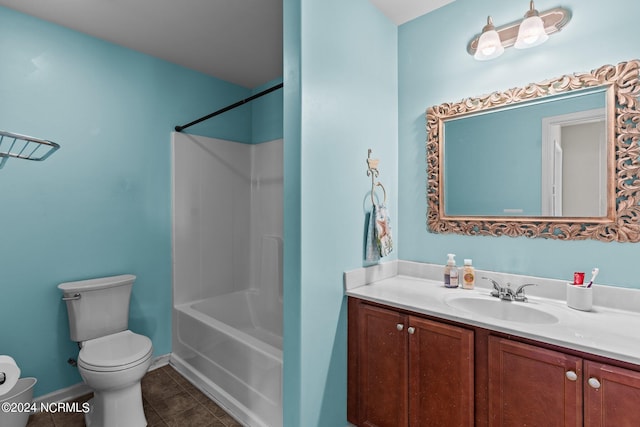 full bathroom with shower / tub combination, vanity, tile patterned flooring, and toilet