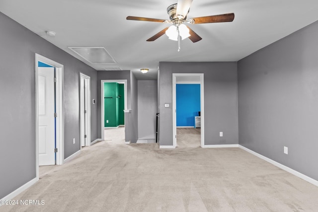 unfurnished bedroom featuring light colored carpet and ceiling fan