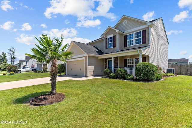 view of front of home with a porch, a garage, and a front yard