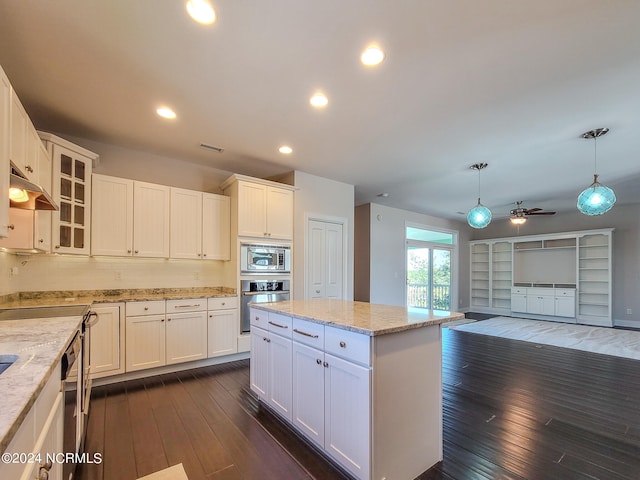 kitchen featuring white cabinetry, ceiling fan, dark hardwood / wood-style floors, and stainless steel appliances