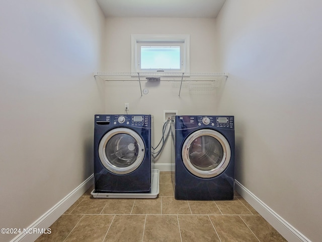 clothes washing area with separate washer and dryer and tile patterned flooring