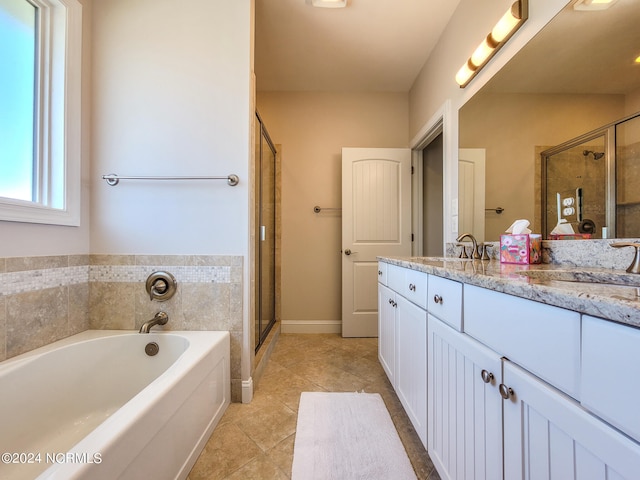 bathroom with shower with separate bathtub, tile patterned flooring, and double sink vanity