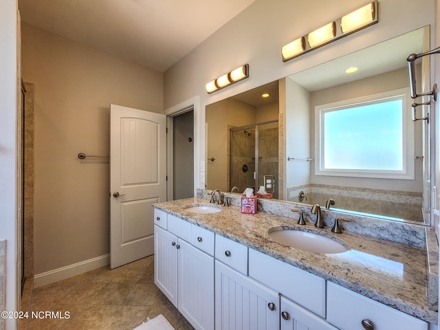 bathroom with dual vanity, separate shower and tub, and tile patterned flooring