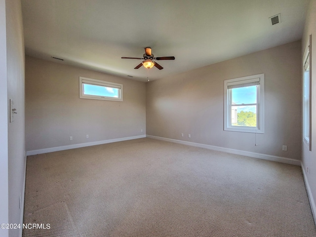 carpeted empty room with ceiling fan