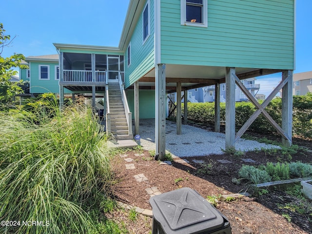 back of house with a sunroom