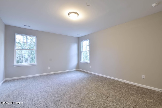 unfurnished room with carpet floors