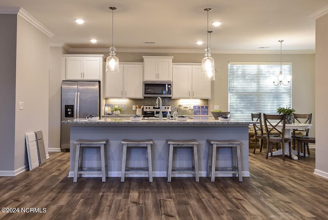 kitchen featuring a breakfast bar area, dark hardwood / wood-style flooring, and stainless steel appliances