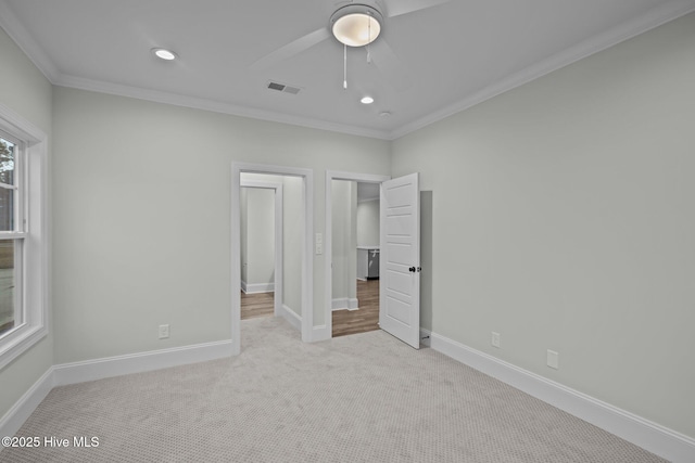 unfurnished bedroom featuring visible vents, baseboards, ornamental molding, carpet floors, and recessed lighting