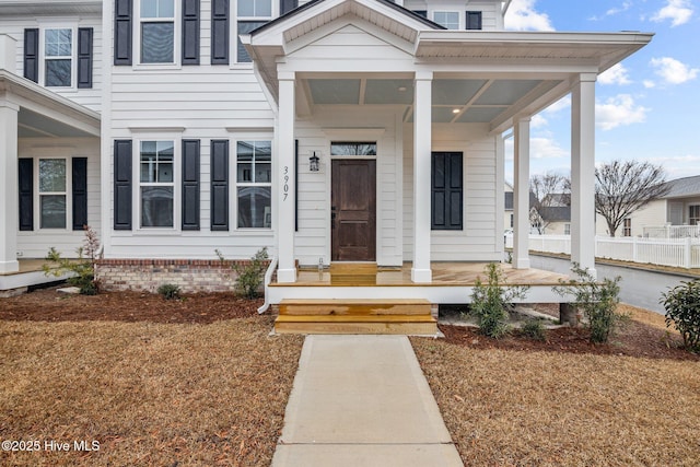 property entrance featuring covered porch