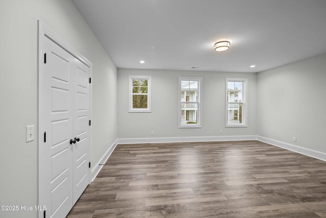 interior space with recessed lighting, baseboards, and dark wood-style flooring