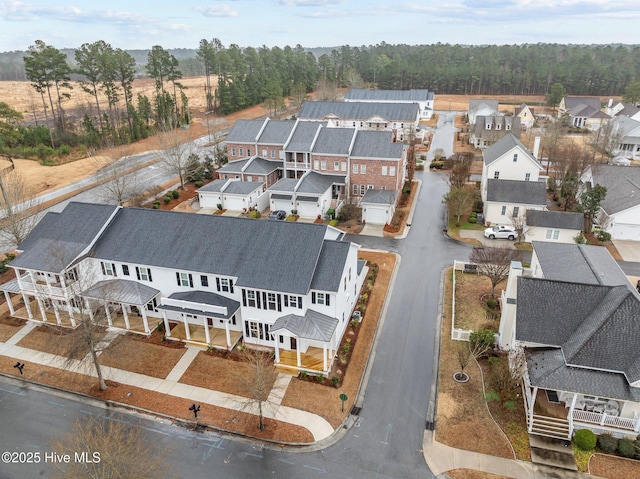 birds eye view of property with a residential view