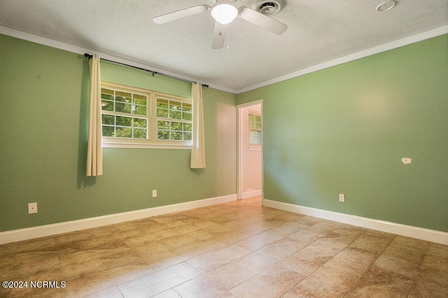 tiled empty room featuring crown molding, a textured ceiling, and ceiling fan