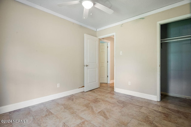 unfurnished bedroom with light tile patterned flooring, ornamental molding, a closet, and ceiling fan