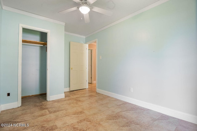 unfurnished bedroom with ornamental molding, a closet, light tile patterned floors, and ceiling fan