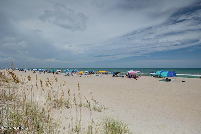 property view of water featuring a beach view