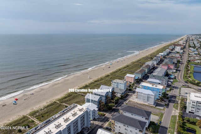 aerial view featuring a water view and a view of the beach