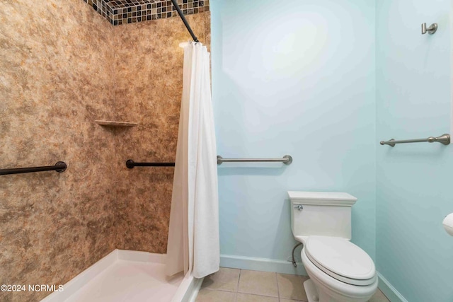 bathroom featuring tile patterned floors, toilet, and a shower with shower curtain