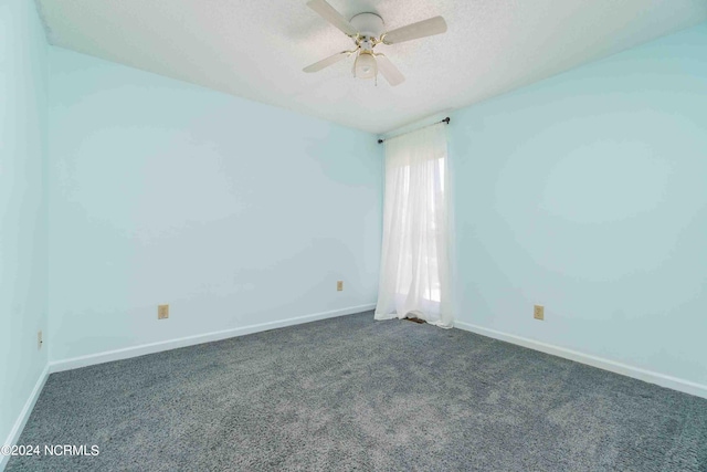 carpeted empty room featuring ceiling fan and a textured ceiling