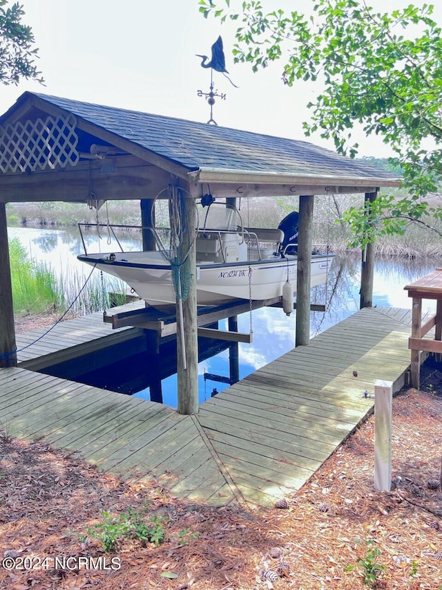 view of dock with a water view