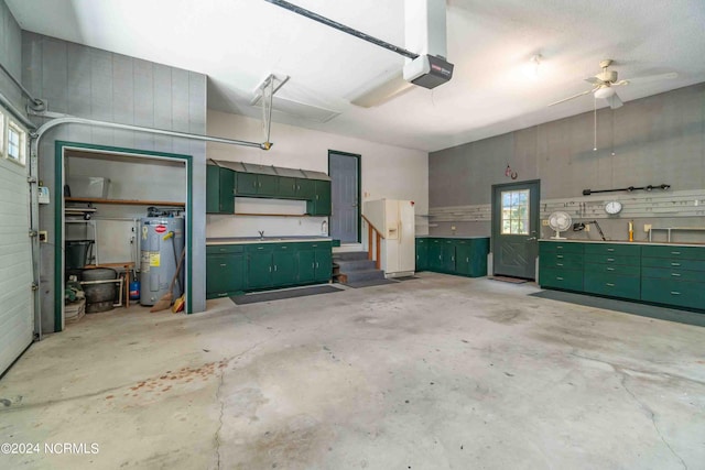 garage with a garage door opener and water heater