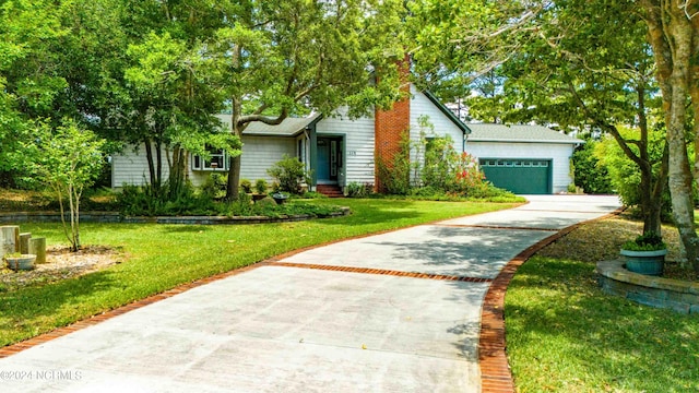 view of front of house featuring a garage and a front yard