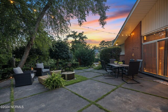 patio terrace at dusk with outdoor dining area