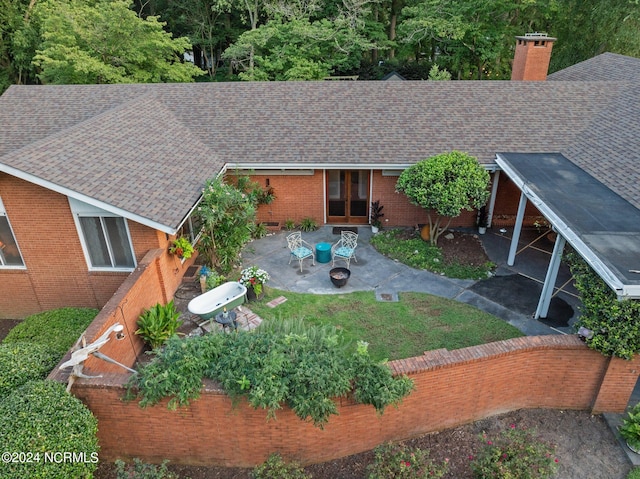 rear view of property featuring a patio