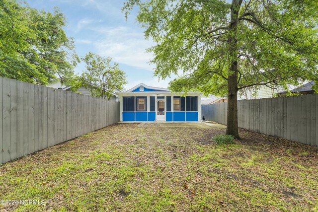 view of yard featuring a sunroom