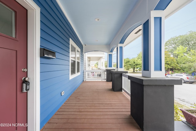 wooden terrace with covered porch