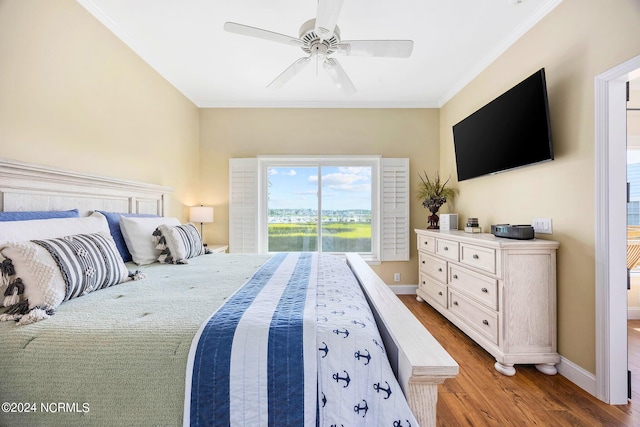 bedroom featuring crown molding, ceiling fan, and light hardwood / wood-style flooring