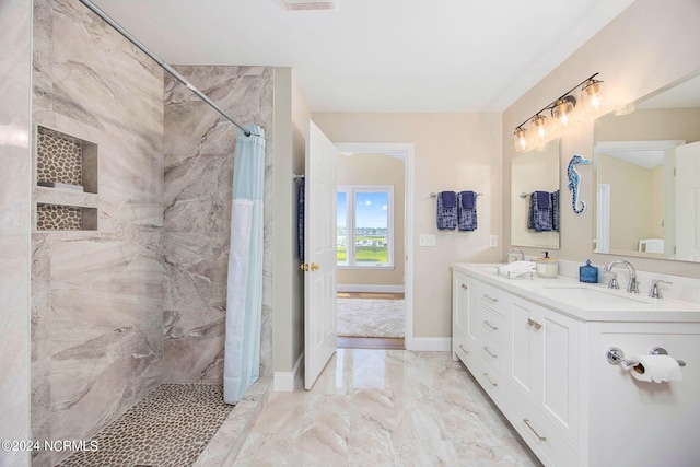 bathroom featuring vanity and a shower with shower curtain