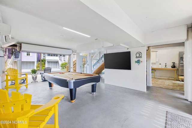 playroom with billiards and concrete floors