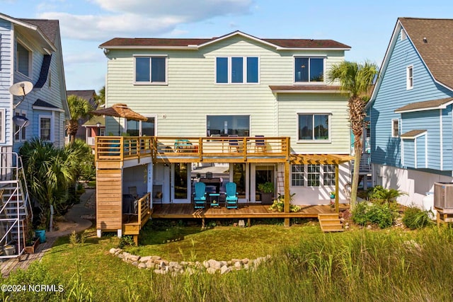 back of house with a pergola and a deck