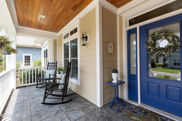 property entrance with covered porch