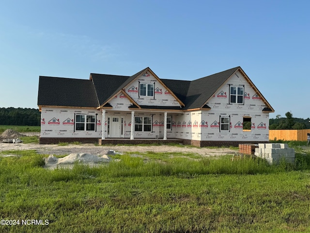 unfinished property featuring a porch