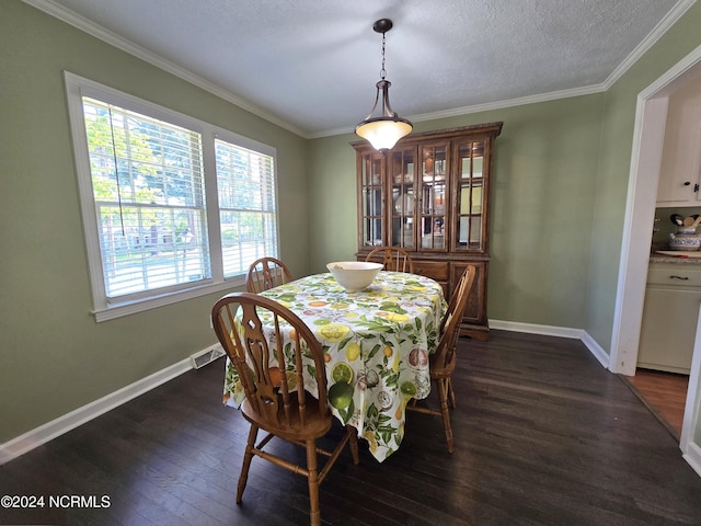 dining area with crown molding, dark hardwood / wood-style floors, and a textured ceiling