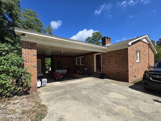 single story home featuring a carport