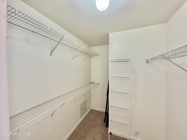 kitchen featuring white cabinetry, white appliances, and kitchen peninsula