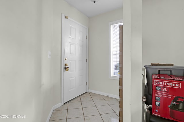 tiled foyer entrance with a wealth of natural light